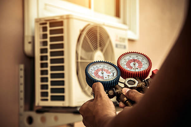 Professional Air Conditioning Service technician working in Summersville, WV